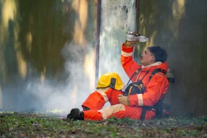 Firefighter tries to cool down after battling fire
